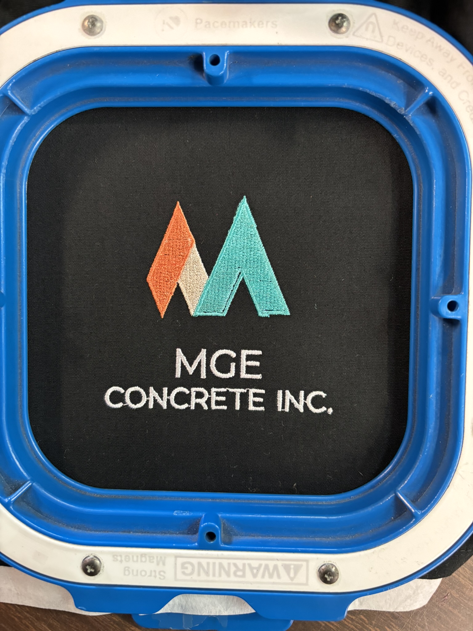 Embroidered logo for MGE Concrete