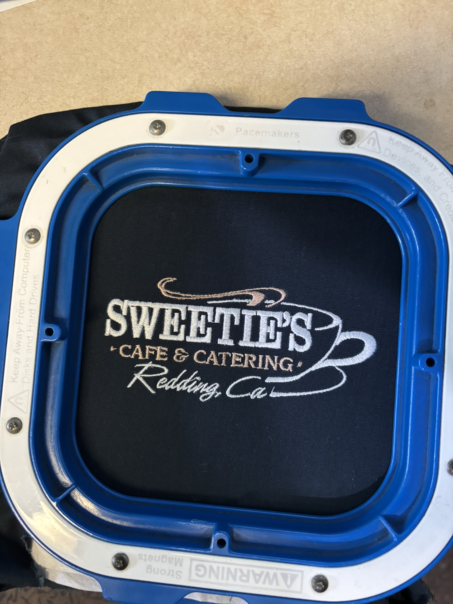 Embroidered logo on a shirt for Sweeties Cafe